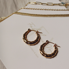 Load image into Gallery viewer, Fabuleux Vous Steel Me Yellow Gold Twist Hoops
