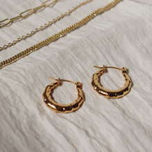Load image into Gallery viewer, Fabuleux Vous Steel Me Yellow Gold Twist Hoops
